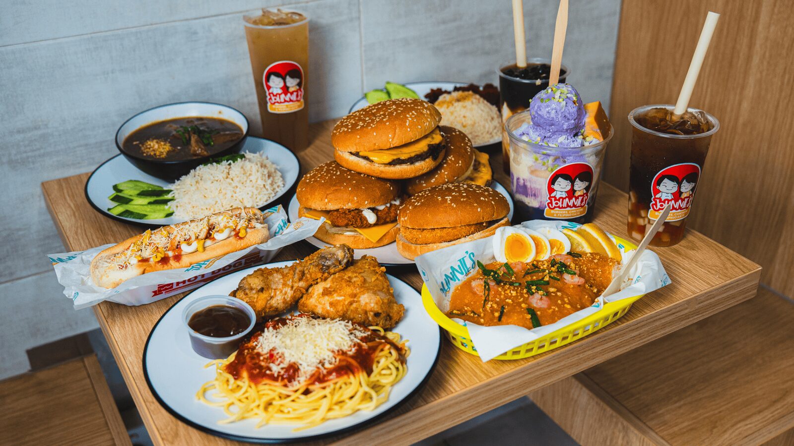Johnnie's fried chicken, burgers and bubble tea spread on kraft paper